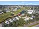 Aerial view of house and surrounding golf course community at 418 Cardiff Rd, Venice, FL 34293