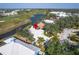 Aerial view of house near golf course and water at 418 Cardiff Rd, Venice, FL 34293