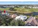 Bird's eye view of property near golf course and lake at 418 Cardiff Rd, Venice, FL 34293