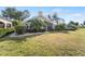 House showcasing a large backyard with screened patio at 418 Cardiff Rd, Venice, FL 34293