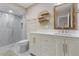 Bright bathroom with a walk-in shower, vanity with quartz countertop at 418 Cardiff Rd, Venice, FL 34293
