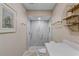 Modern bathroom with marble tile shower and quartz countertop at 418 Cardiff Rd, Venice, FL 34293