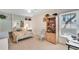 Charming bedroom with floral bedding and built-in shelving at 418 Cardiff Rd, Venice, FL 34293
