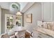Charming breakfast nook with white table and chairs, overlooking a patio at 418 Cardiff Rd, Venice, FL 34293