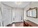 Elegant entryway with hardwood floors and mirror at 418 Cardiff Rd, Venice, FL 34293