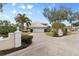 House exterior with a long driveway and lush landscaping at 418 Cardiff Rd, Venice, FL 34293
