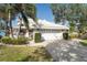Beautiful home with lush landscaping and a two-car garage at 418 Cardiff Rd, Venice, FL 34293