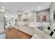 Bright kitchen with white cabinets, marble countertops, and stainless steel appliances at 418 Cardiff Rd, Venice, FL 34293