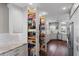 Well-equipped kitchen with pull-out pantry and ample storage at 418 Cardiff Rd, Venice, FL 34293