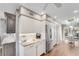 Kitchen features white cabinets, stainless steel appliances, and a breakfast nook at 418 Cardiff Rd, Venice, FL 34293