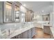 Kitchen boasts granite counters & glass-front cabinets at 418 Cardiff Rd, Venice, FL 34293