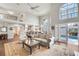 Open living area with hardwood floors, high ceilings, and pool view at 418 Cardiff Rd, Venice, FL 34293