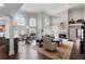 Spacious living room with hardwood floors, high ceilings, and fireplace at 418 Cardiff Rd, Venice, FL 34293