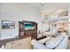 Open living room with high ceilings and a view to the Primary bedroom at 418 Cardiff Rd, Venice, FL 34293