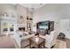 Bright living room with hardwood floors and fireplace at 418 Cardiff Rd, Venice, FL 34293