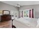Spacious main bedroom with a king-size bed and access to a patio at 418 Cardiff Rd, Venice, FL 34293