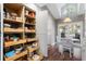 Large pantry with pull-out shelves for easy access to canned goods and dry goods at 418 Cardiff Rd, Venice, FL 34293