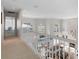 Open upper hallway overlooking living room and pool area at 418 Cardiff Rd, Venice, FL 34293