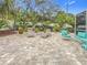 Landscaped backyard with a patio, offering ample space for relaxation at 1044 Rosetree Ln, Tarpon Springs, FL 34689