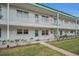 Two-story building with balconies and landscaping at 5216 81St N St # 3, St Petersburg, FL 33709