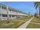 Two-story building with balconies and landscaping at 5216 81St N St # 3, St Petersburg, FL 33709