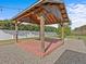 Wooden pergola with a red deck in the backyard at 708 Tower Grove Dr, Plant City, FL 33567