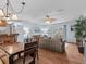 Bright dining area with wood table and chairs, adjacent to kitchen at 709 Mandalay Ave, Clearwater Beach, FL 33767