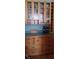 Butlers pantry with glass-front cabinetry, ample storage, and wood countertops at 13621 Mcintosh Rd, Thonotosassa, FL 33592