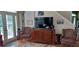 Living room with large TV and comfortable seating at 13621 Mcintosh Rd, Thonotosassa, FL 33592