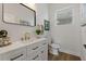 Modern bathroom with white vanity, gold fixtures, and stylish flooring at 4501 21St N St, St Petersburg, FL 33714