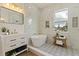 Spa-like bathroom with soaking tub, marble shower, and patterned floors at 4501 21St N St, St Petersburg, FL 33714