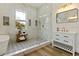 Modern bathroom with walk-in shower, soaking tub, and marble tile at 4501 21St N St, St Petersburg, FL 33714