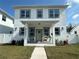 Two-story house with white exterior, covered porch, and landscaping at 4501 21St N St, St Petersburg, FL 33714