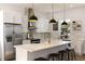 Modern kitchen with white cabinets, a large island, and gold accents at 4501 21St N St, St Petersburg, FL 33714