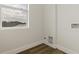 Simple laundry room with vinyl flooring and a window at 4501 21St N St, St Petersburg, FL 33714