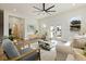 Bright living room with comfy seating, large windows, and hardwood floors at 4501 21St N St, St Petersburg, FL 33714