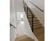Modern staircase with wood steps and cable railing at 4501 21St N St, St Petersburg, FL 33714