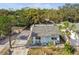Aerial view of a light blue house and its surroundings at 8416 N Semmes St, Tampa, FL 33604