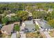 An aerial shot of a charming light blue house and surrounding area at 8416 N Semmes St, Tampa, FL 33604