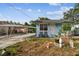 Quaint light blue house with small front yard at 8416 N Semmes St, Tampa, FL 33604