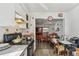 Kitchen with stove, cabinets and dining area at 8416 N Semmes St, Tampa, FL 33604