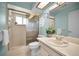 Updated bathroom with a shower and vanity at 1669 Fry Ct, Dunedin, FL 34698