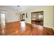 Dining room with hardwood floors and access to a screened patio at 1669 Fry Ct, Dunedin, FL 34698