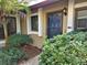 Inviting front entrance with lush landscaping and a charming walkway at 1669 Fry Ct, Dunedin, FL 34698