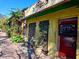 Quaint building exterior with aged wood shutters and potted plants at 1705 51St Street S, Gulfport, FL 33707