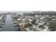 Wide aerial view of a waterfront community with many houses and boats at 4008 Dana Shores Dr, Tampa, FL 33634