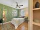 Bedroom features an accent wall, ceiling fan, two windows and ample lighting at 420 40Th N St, St Petersburg, FL 33713