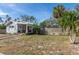 A cozy single-Gathering home features a well-kept lawn and a classic wooden fence at 420 40Th N St, St Petersburg, FL 33713