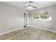 Bright bedroom with wood-look floors and access to bathroom at 6602 S Emerson Ave, St Petersburg, FL 33707