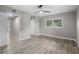 Bedroom with ceiling fan, neutral walls, and wood-look flooring at 6602 S Emerson Ave, St Petersburg, FL 33707